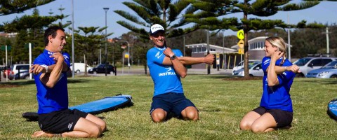 Stretches before surf lesson at Maroubra